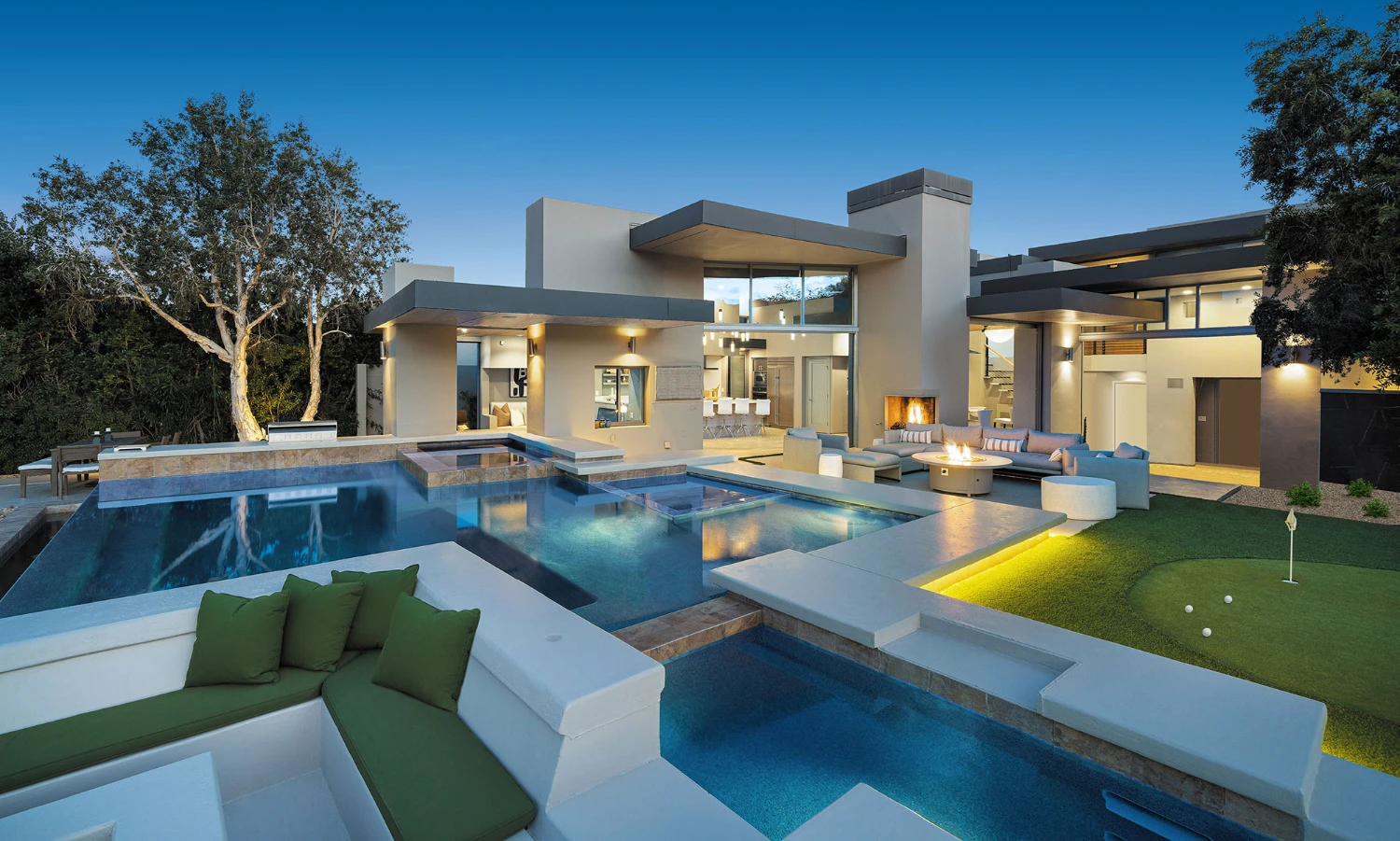 Contemporary luxury home in Palm Desert with a resort-style pool, modern architecture and expansive outdoor living spaces.